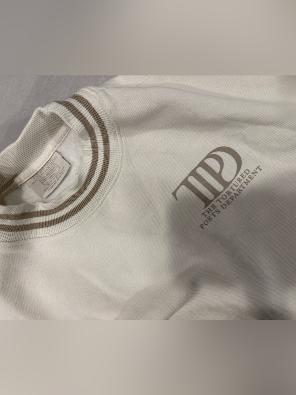 The Tortured Poets Department Cream Logo Sweatshirt with Taupe Stripe Collar